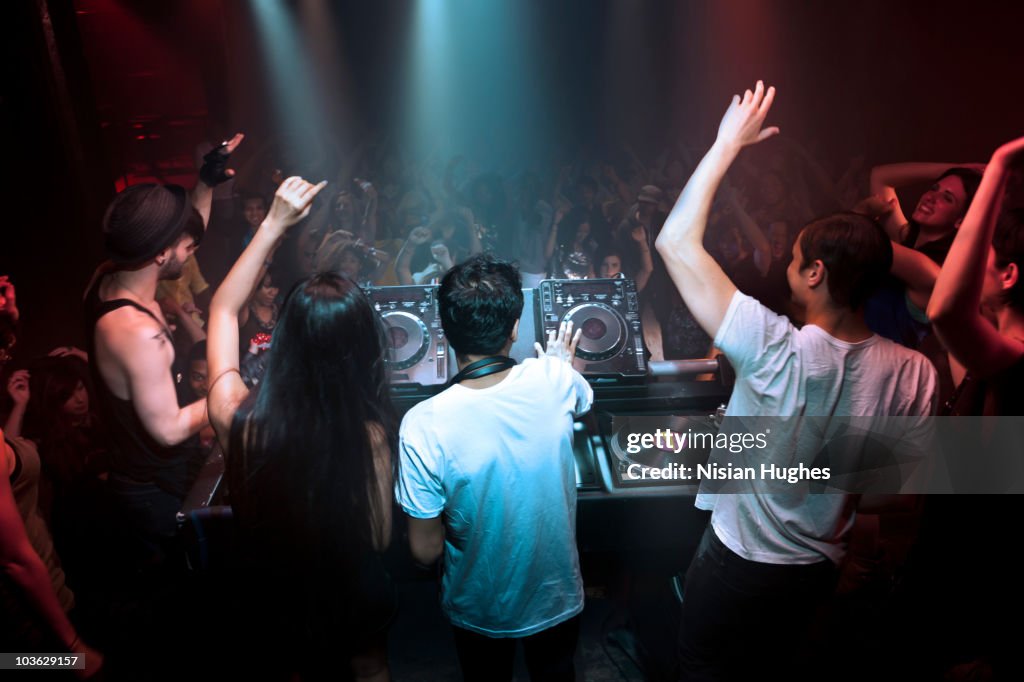 DJ playing music in nightclub