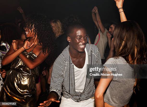 couple dancing together in nightclub - nightclub stock pictures, royalty-free photos & images