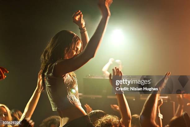 dancing in nightclub - dj concert stock pictures, royalty-free photos & images
