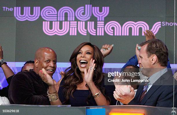 Kevin Hunter, Wendy Williams and Bruce Oust rings the opening bell at the NASDAQ MarketSite on August 25, 2010 in New York City.