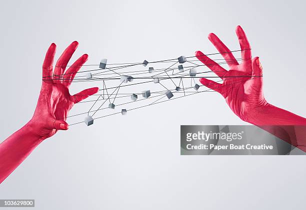 red painted hands with 3d cats in the cradle  - image manipulation stock pictures, royalty-free photos & images