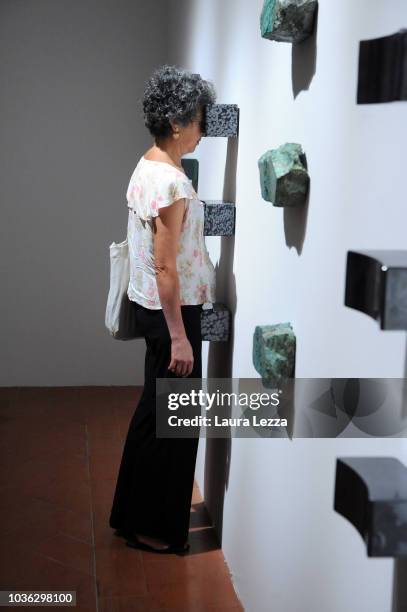 People attend the presentation of the exhibition 'Marina Abramovic The Cleaner' taking part in the famous artist's work, during in Palazzo Strozzi on...