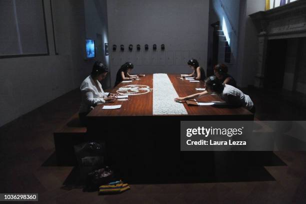 People attend the presentation of the exhibition 'Marina Abramovic The Cleaner' taking part in the famous artist's work, during in Palazzo Strozzi on...