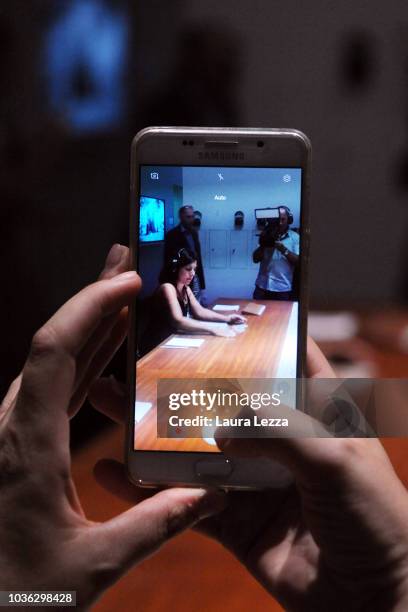 People attend the presentation of the exhibition 'Marina Abramovic The Cleaner' taking part in the famous artist's work, during in Palazzo Strozzi on...