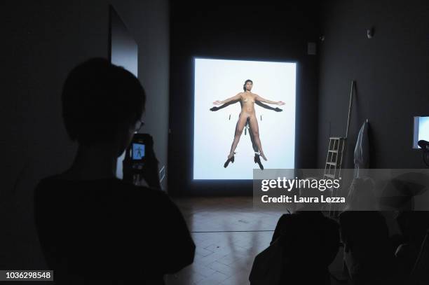 People attend the re-performance of the opera Luminosity by Marina Abramovic realized in 1997, during the presentation of the exhibition 'Marina...