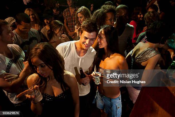 young man and woman flirting at a bar - flirten stockfoto's en -beelden