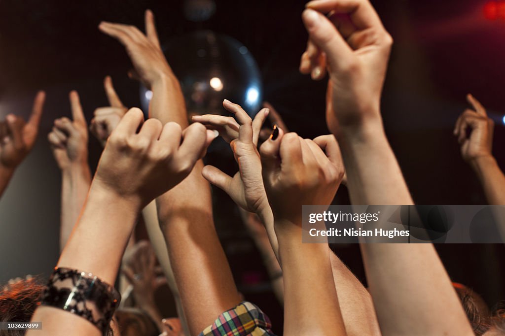 Hands in the air at a nighclub