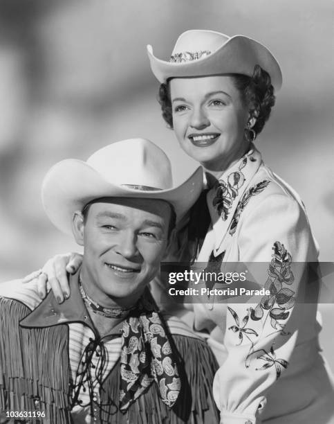 Singer and actor Roy Rogers and his wife Dale Evans pictured smiling with Evans resting her hand on Rogers' shoulder, USA, circa 1955. Both Rogers...