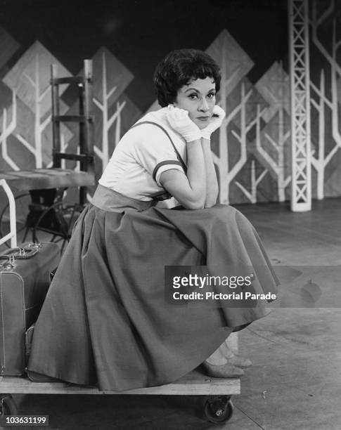 Chita Rivera, American actress, dancer, and singer, USA, circa 1955. Rivera, pictured with her chin resting in her hands, wearing white gloves, is...