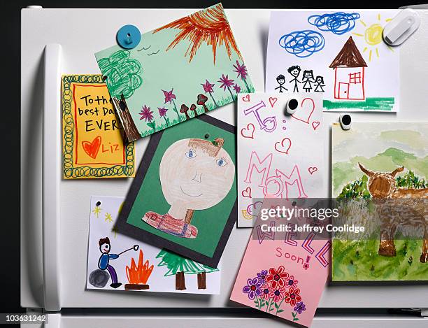 children's drawings on refrigerator - fridge magnet stock pictures, royalty-free photos & images