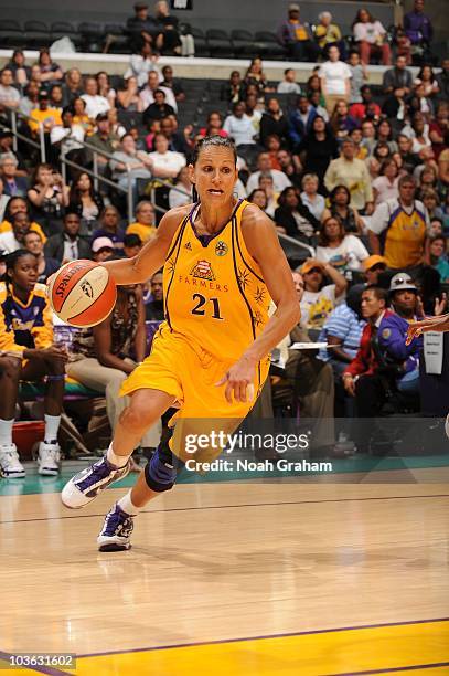 Ticha Penicheiro of the Los Angeles Sparks drives during the WNBA game against the Phoenix Mercury at Staples Center on August 17, 2010 in Los...