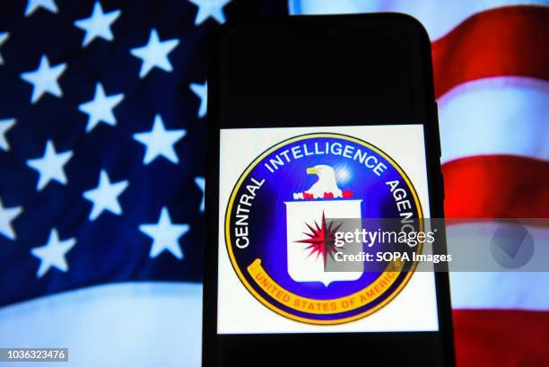 In this photo illustration, the Central Intelligence Agency logo is seen displayed on an Android mobile phone.