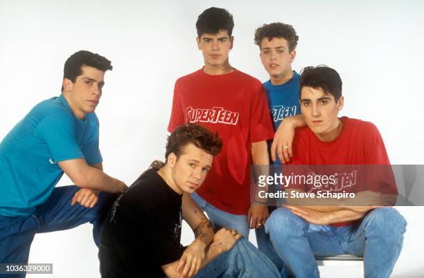 Portrait of the American pop group New Kids on the Block as they pose against a white background, Los Angeles, California, 1989. From left, Danny...