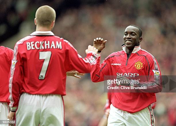 Dwight Yorke of Manchester United celebrates his goal with team mate David Beckham during the FA Carling Premiership match against Chelsea at Old...