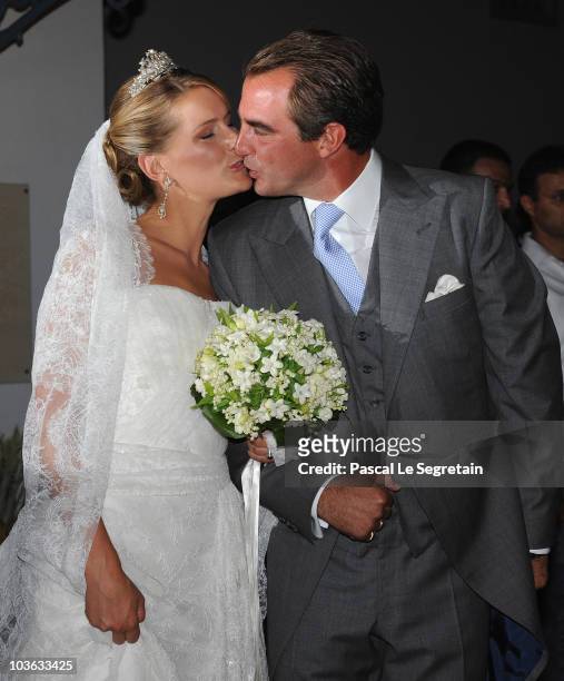 Tatania Blatnik and Prince Nikolaos of Greece kiss each other outside the Cathedral of Ayios Nikolaos after getting married on August 25, 2010 in...