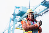 African-American woman working at shipping port