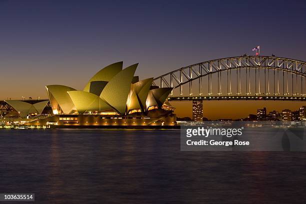 The iconic Sydney Opera House and Harbour Bridge are viewed at sunset on August 8, 2010 Sydney, Australia.The multi-use performing arts venue,...