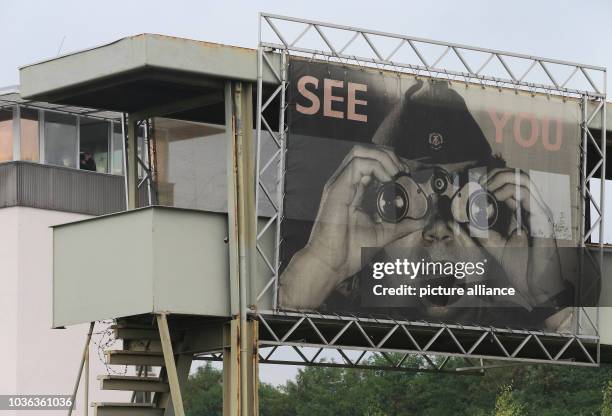 Giant banner which reads 'see you' hangs from the special inspection bridge next to the renovated conning tower at the 'Gedenkstaette Deutsche...