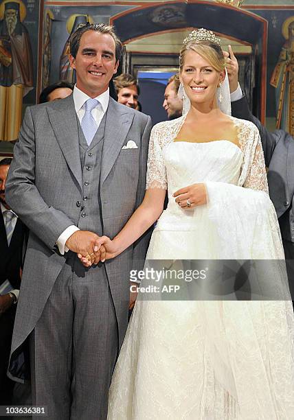 Former Prince Nikolaos of Greece and Tatiana Blatnik pose during their wedding ceremony in Saint Nicolas church at the island of Spetses on August...