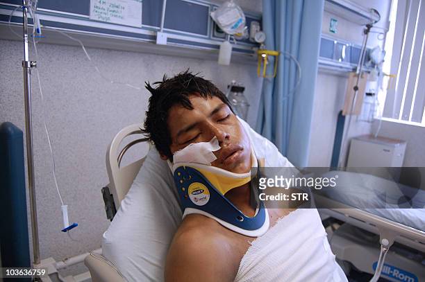 Ecuadorean national Luis Fredy Lala, survivor of a massacre, lies on her bed at hospital in Matamoros, Mexico, on August 25, 2010. A shootout in far...
