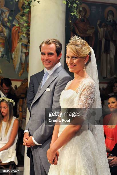 Prince Nikolaos of Greece and Tatania Blatnik pose during their wedding ceremony in the Cathedral of Ayios Nikolaos on August 25, 2010 in Spetses,...