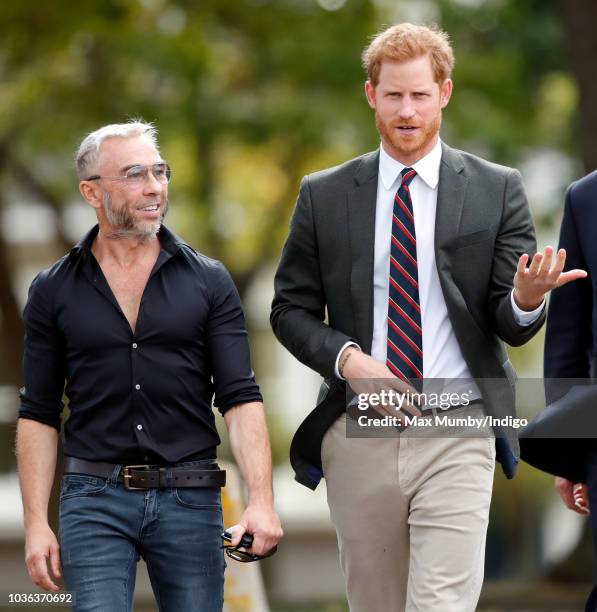 Prince Harry, Duke of Sussex accompanied by James Holder visits The Royal Marines Commando Training Centre on September 13, 2018 in Lympstone,...