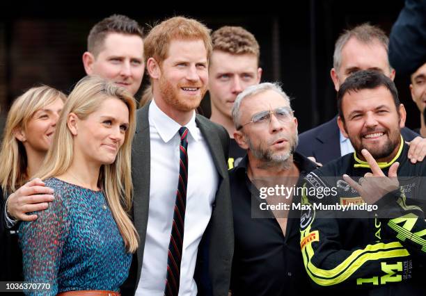 Prince Harry, Duke of Sussex accompanied by James Holder and Paul Vice visits The Royal Marines Commando Training Centre on September 13, 2018 in...