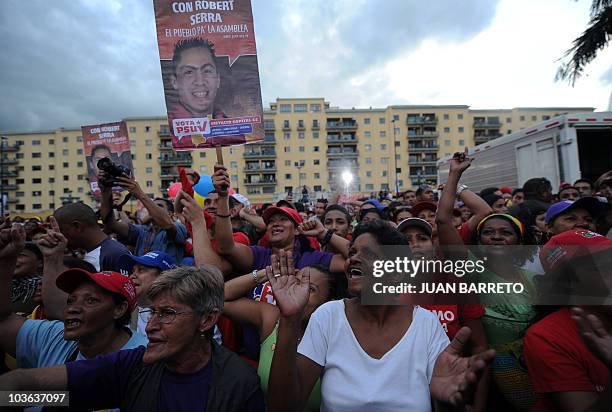 Supporters of Venezuelan President Hugo Chavez participate of a rally in favour of the candidate for the ruling party for the parliamentary elections...