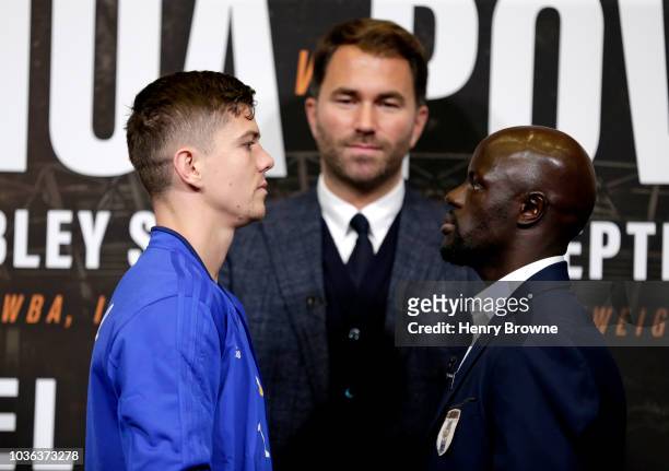 Luke Campbell and Yvan Mendy face off as Promoter, Eddie Hearn looks on during the Anthony Joshua And Alexander Povetkin Press Conference on...