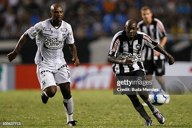 Somalia of Botafogo struggles for the ball with Heleno of Ceara during a match as part of the Brazilian Championship Serie A at Engenhao Stadium on...