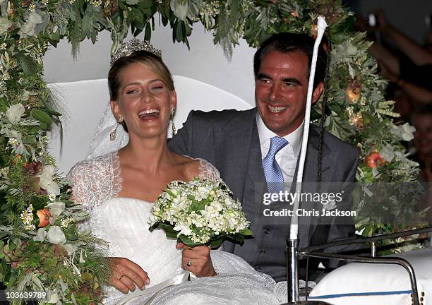 Princess Nikolaos of Greece and Denmark leave in a horse drawn carriage after getting married at the Cathedral of Ayios Nikolaos on August 25, 2010...