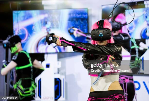 An attendee wearing a VR headset plays a video game during the Tokyo Game Show 2018 on September 20, 2018 in Chiba, Japan. The Tokyo Game Show is...