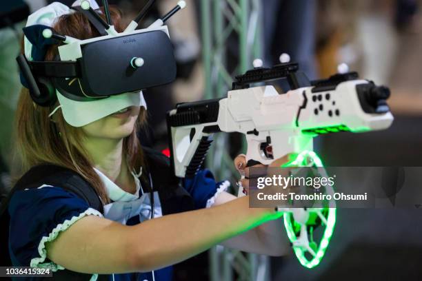 An attendee wearing a VR headset uses a plastic gun mounted sensors during the Tokyo Game Show 2018 on September 20, 2018 in Chiba, Japan. The Tokyo...