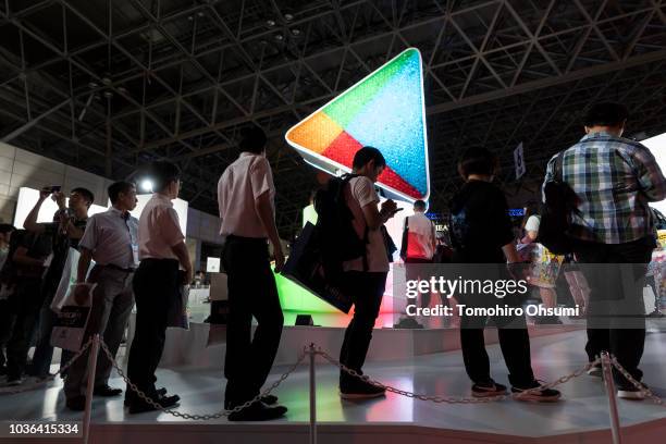 Attendees stand in front of the Google Play booth during the Tokyo Game Show 2018 on September 20, 2018 in Chiba, Japan. The Tokyo Game Show is held...