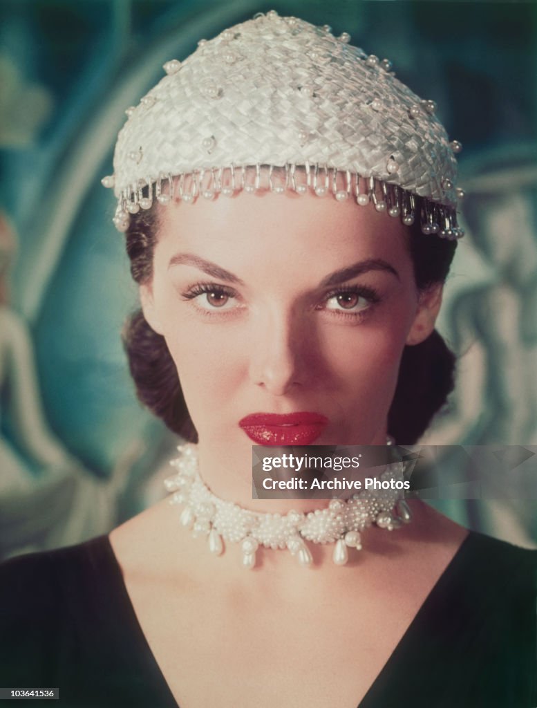 Headshot of actress Jane Russell pictured wearing a pearl-studded ...