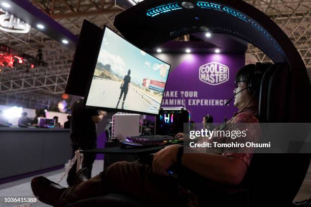 An attendee plays a video game in the Cooler Master Co. Booth during the Tokyo Game Show 2018 on September 20, 2018 in Chiba, Japan. The Tokyo Game...