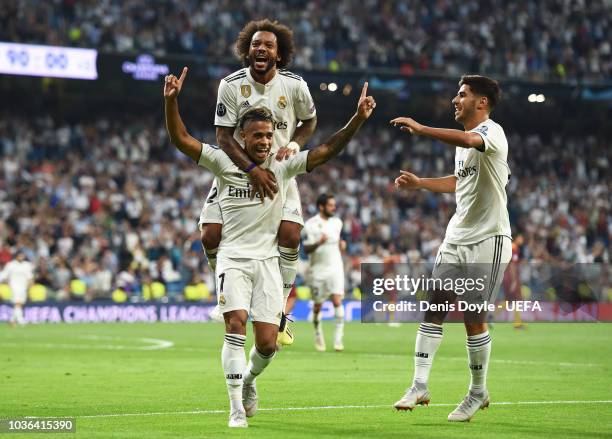 Mariano Diaz of Real Madrid celebrates with Marcelo and Marco Asensio after scoring his team's third goal during the Group G match of the UEFA...