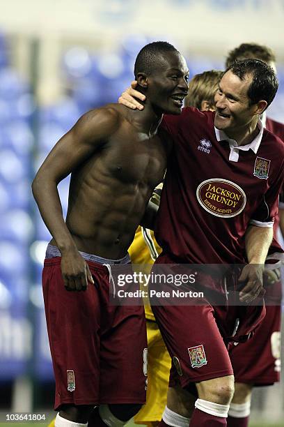 Abdul Osman of Northampton Town is congratulated by team mate Steve Guinan after scoring his sides winning penalty in a penalty shoot out during the...