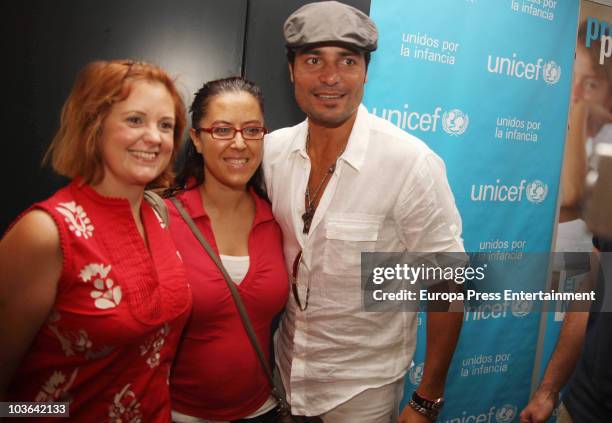 Chayanne poses with some fans during the press conference to present a charity concert for Unicef and Fundacion Iberostar on August 25, 2010 in Palma...