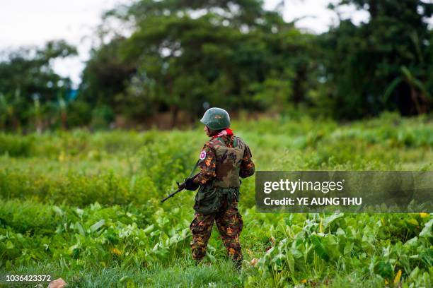 Myanmar soldier guards an area at the Sittwe airport as British foreign minister Jeremy Hunt arrives in Sittwe, Rakhine state, on September 20, 2018....