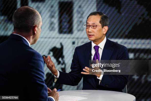 Kewsong Lee, co-chief executive officer of Carlyle Group LP, speaks during a Bloomberg Television interview in New York, U.S., on Thursday, Sept. 20,...