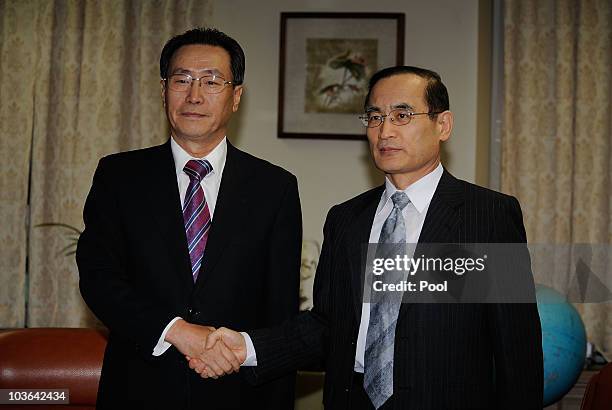 China's chief nuclear envoy Wu Dawei shakes hands with South Korea's chief nuclear envoy Wi Sung-Lac before their meeting at the foreign ministry on...