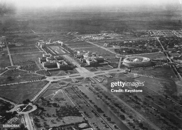 An aerial view of government buildings in Old Delhi, India, circa 1935. On the left are the north and south blocks of the Secretariat Building with...