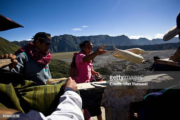 Tenggerese worshipper throws vegetables for an offering during the Yadnya Kasada Festival at crater of Mount Bromo on August 26, 2010 in Probolinggo,...