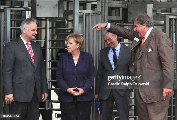 Johannes Teyssen, CEO of energy supplier E.ON AG, German Chancellor Angela Merkel, Environment Minister Norbert Roettgen and Juergen Grossmann, CEO...