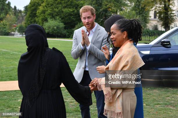 Prince Harry, Duke of Sussex, Meghan, Duchess of Sussex and her mother, Doria Ragland are greeted by Zahira Ghaswala , Hubb community kitchen...