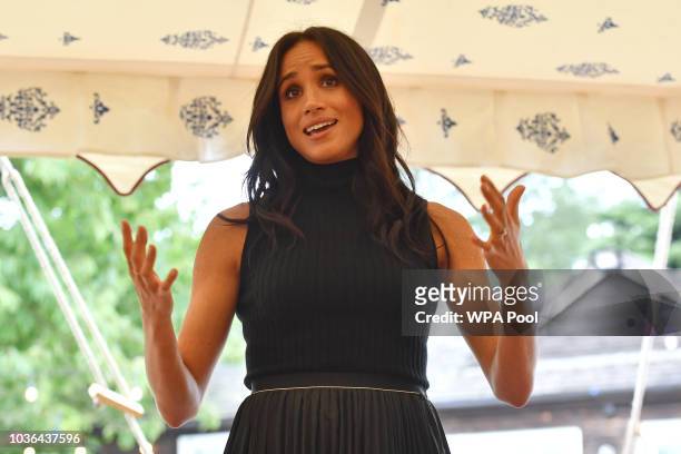 Meghan, Duchess of Sussex speaks to guests during an event to mark the launch of a cookbook with recipes from a group of women affected by the...