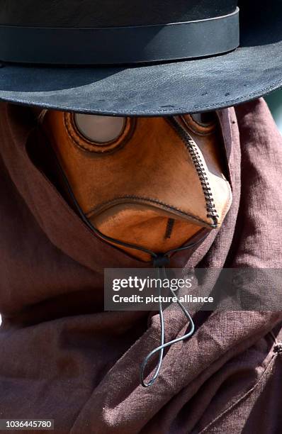 Participant in the medieval festival Phantasy Spectaculum wears a plague mask in Bueckeburg, Germany, 12 July 2014. Phantasy Spectaculum is a...