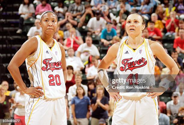 Briann January and Tully Bevilaqua of the Indiana Fever stand on the court during the game against the Minnesota Lynx on August 22, 2010 at Conseco...