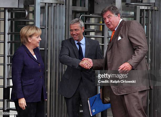 German Chancellor Angela Merkel, Environment Minister Norbert Roettgen and Juergen Grossmann, CEO of German energy giant RWE arrive at the Emsland...